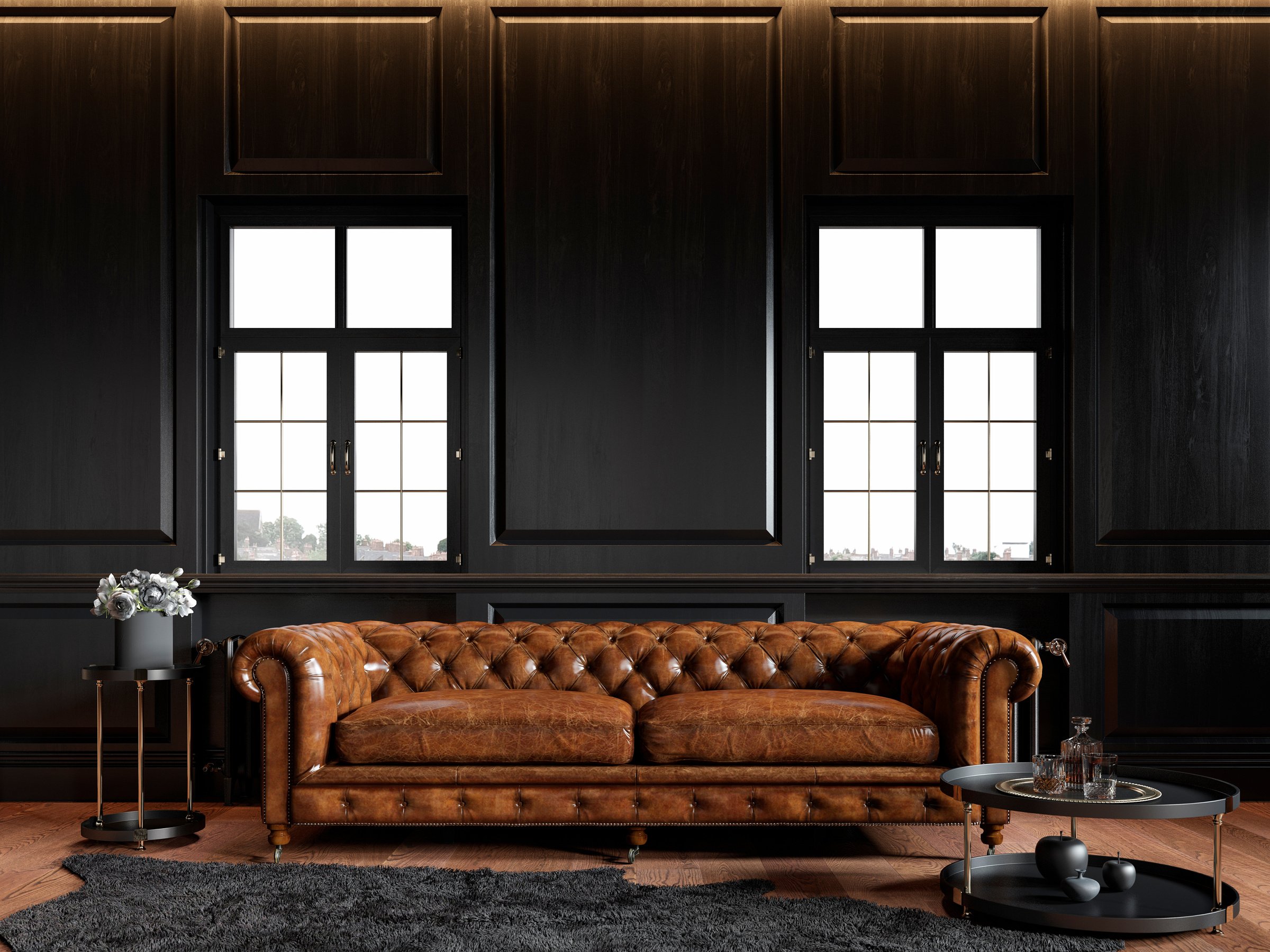 Classic loft black interior with wood panel, chesterfield couch, carpet, flowers, coffee table and windows.